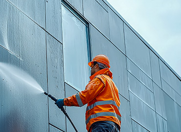 man washing wall
