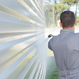 man pressure washing