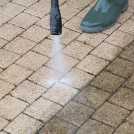 man pressure washing